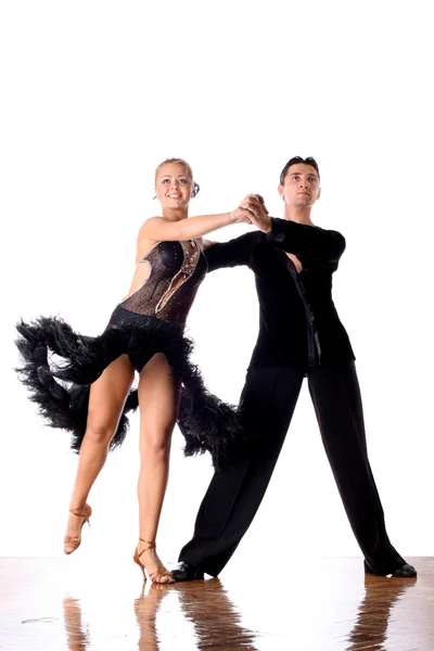 Dancers in ballroom against white background — Stock Photo, Image