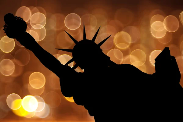 stock image Silhouette NY Statue of Liberty against light circle as firework