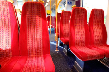 Vacant seats inside a train clipart