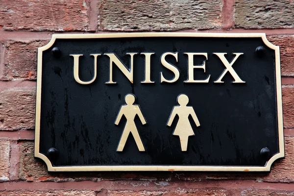 stock image Gold restroom signs unisex