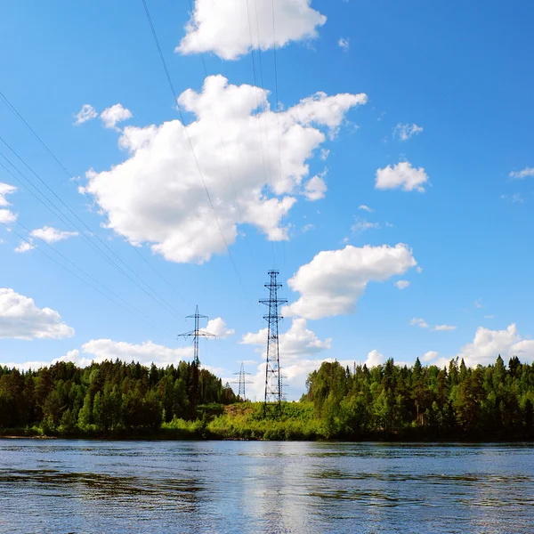 High-voltage line across the river — Stock Photo, Image