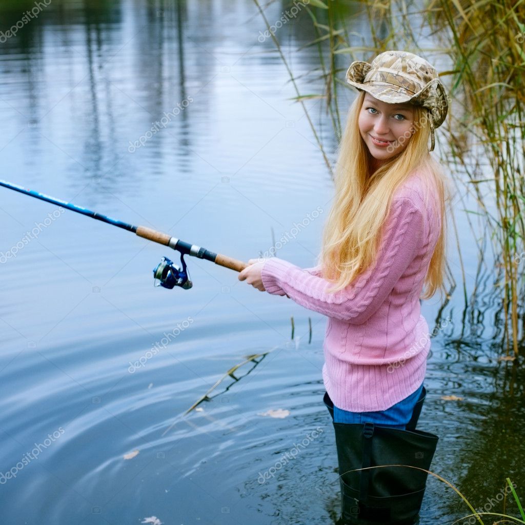 Young Woman Fishing At Pond Stock Photo, Picture and Royalty Free