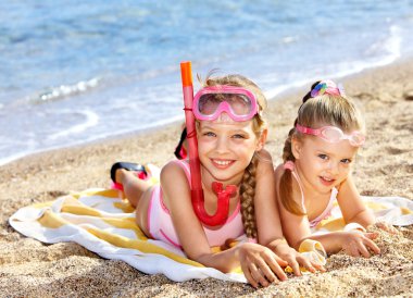 Children playing on beach. Snorkeling. clipart