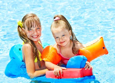 Children in swimming pool. clipart