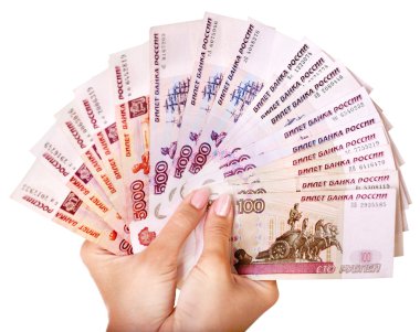 Female hand with money Russian rouble. clipart