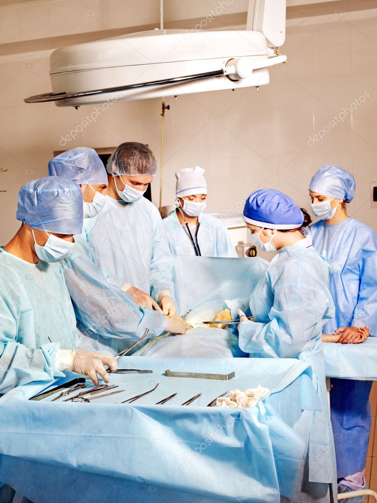 Patient on gurney in operating room.