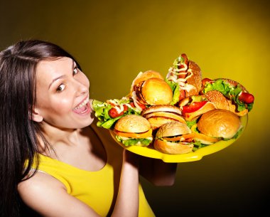 Thin woman holding hamburger. clipart