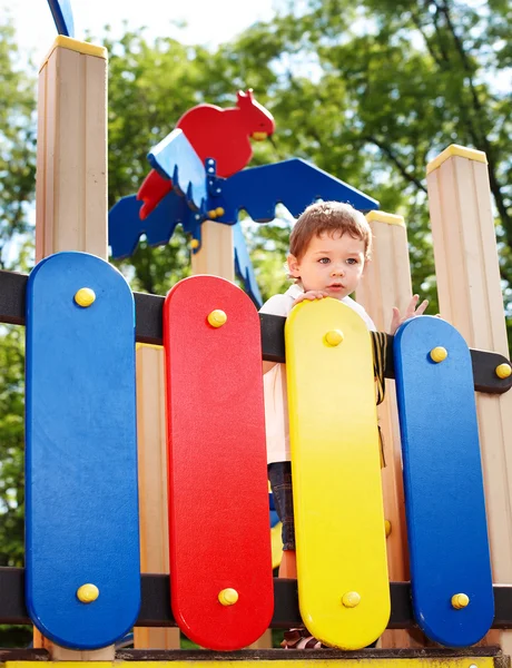 Child on slide outdoor in park. — Stock Photo, Image