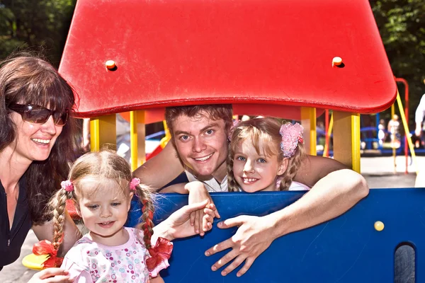 Familj och grupp barn på lekplats. — Stock fotografie