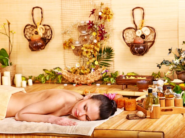 Woman getting massage in bamboo spa. — Stock Photo, Image