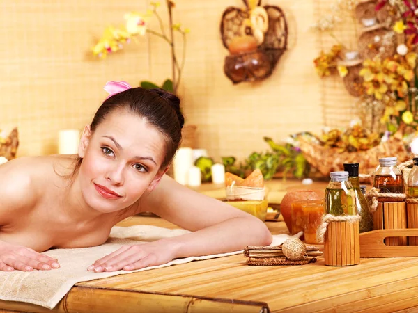 Woman getting massage in bamboo spa. — Stock Photo, Image