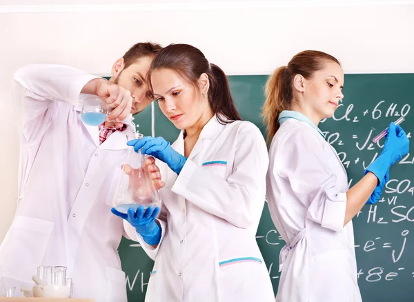 Group chemistry student with flask. — Stock Photo, Image