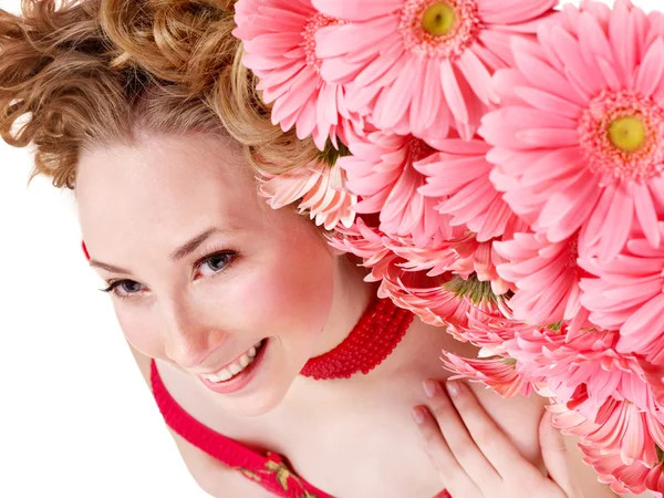 stock image Young woman lying on flowers.