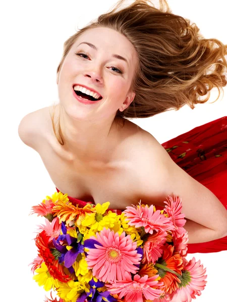 Onnellinen nuori nainen jolla kukkia . — kuvapankkivalokuva