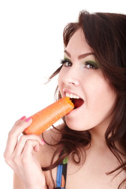 Face of girl eating carrot.