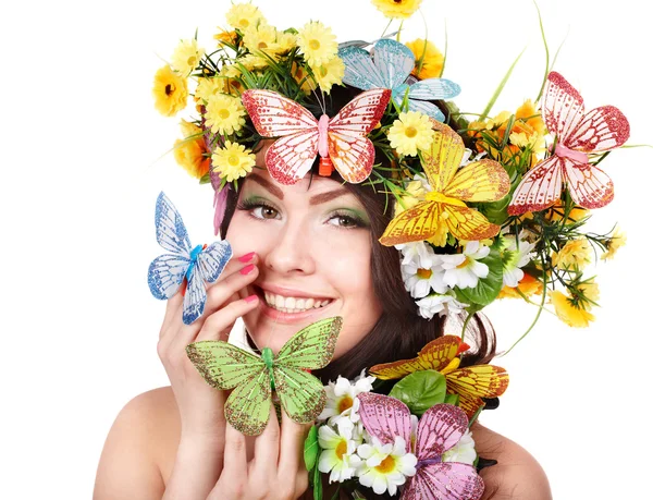 Meisje met vlinder en bloem. schoonheid en mode. — Stockfoto