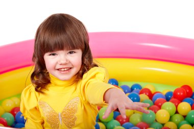 Child in group of colourful ball. clipart