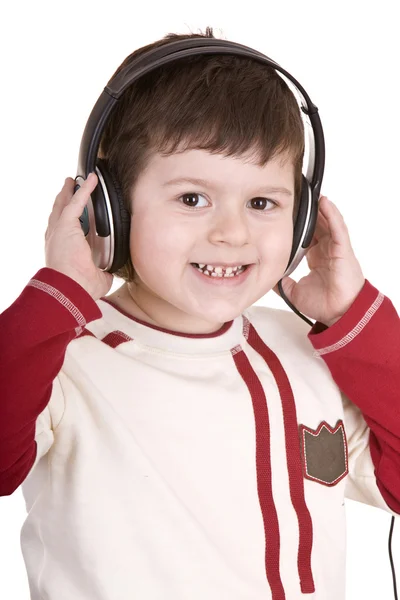 เด็กชายในหูฟังฟังฟังเพลง . — ภาพถ่ายสต็อก