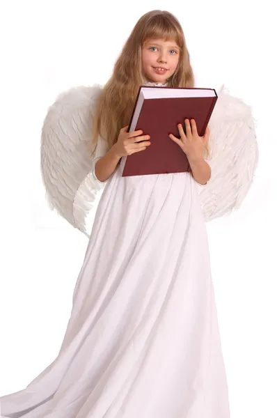 Girl in angel costume with book. — Stock Photo, Image