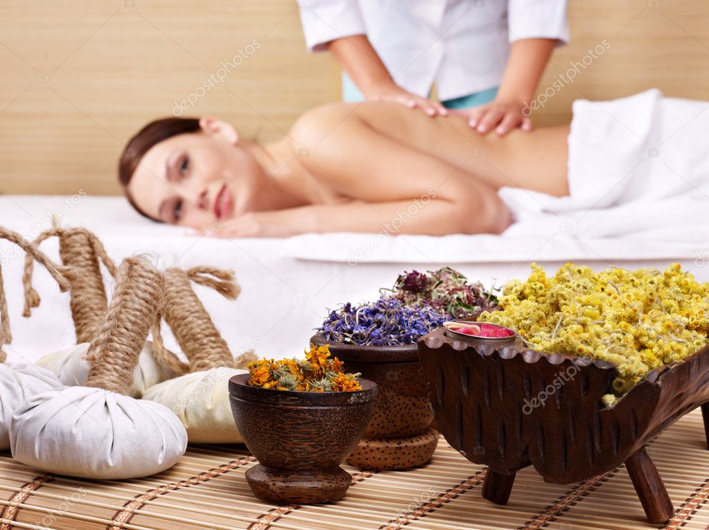 Still life with woman on massage table in beauty spa.