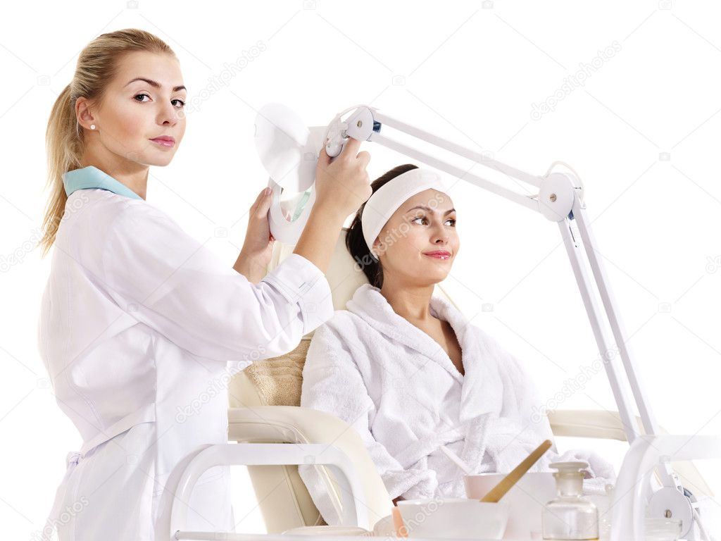 Woman on massage table in beauty spa.