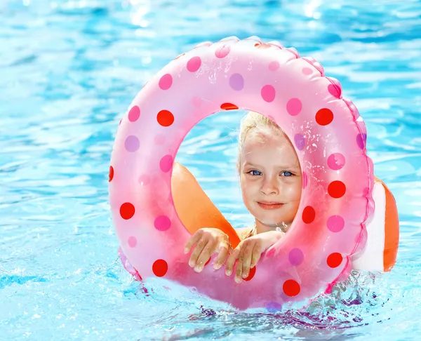Kid sitting on inflatable ring. — Stock Photo, Image