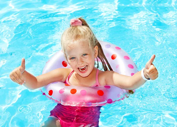 Kid sitting on inflatable ring. — Stock Photo, Image