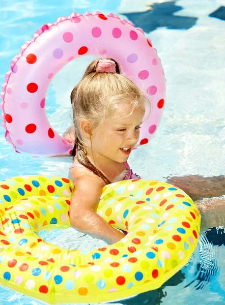 Kid sitting on inflatable ring. — Stock Photo, Image