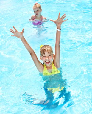 Children in swimming pool. clipart