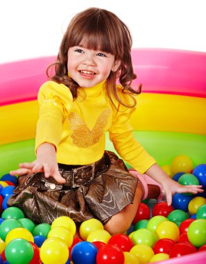 Happy child in group colourful ball. clipart