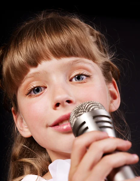 stock image Singing of child in microphone.