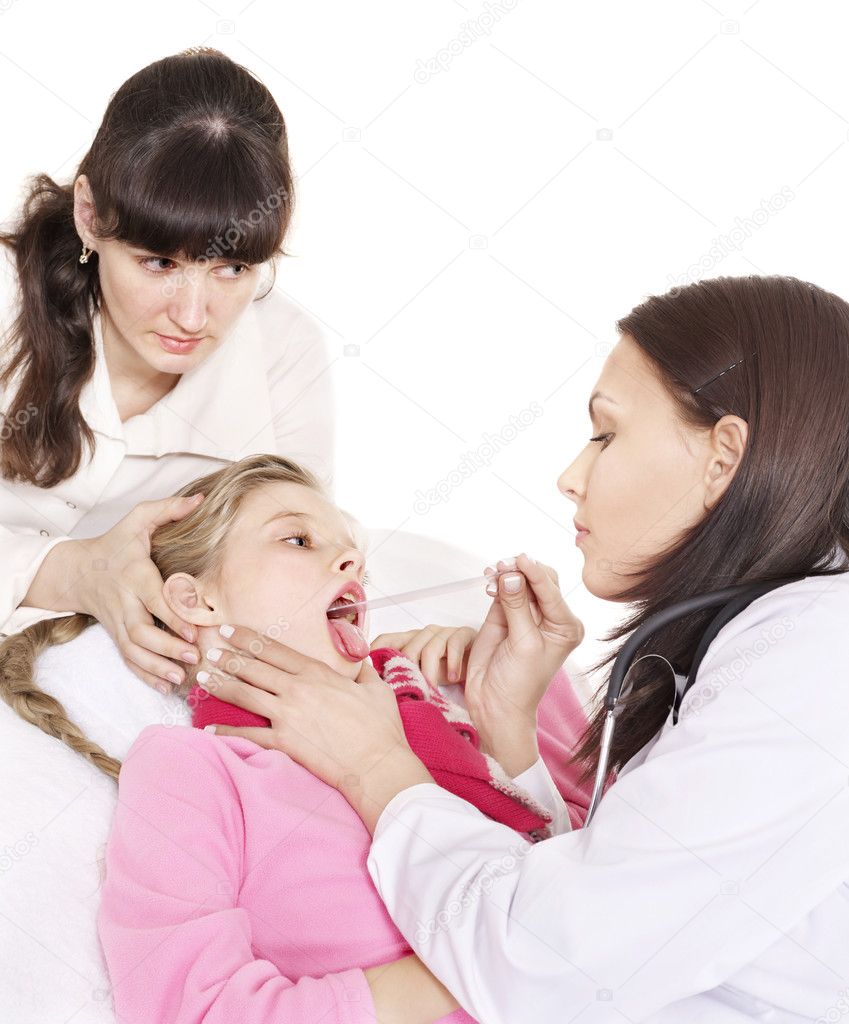 Doctor exams child with sore throat.