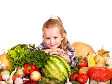 Child with vegetable on kitchen. clipart