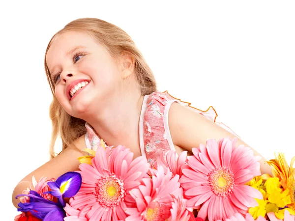 Gelukkig kind bedrijf bloemen. — Stockfoto