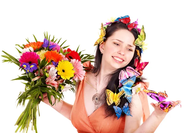 Дівчина в весняній зачісці з квіткою і метеликом . — стокове фото