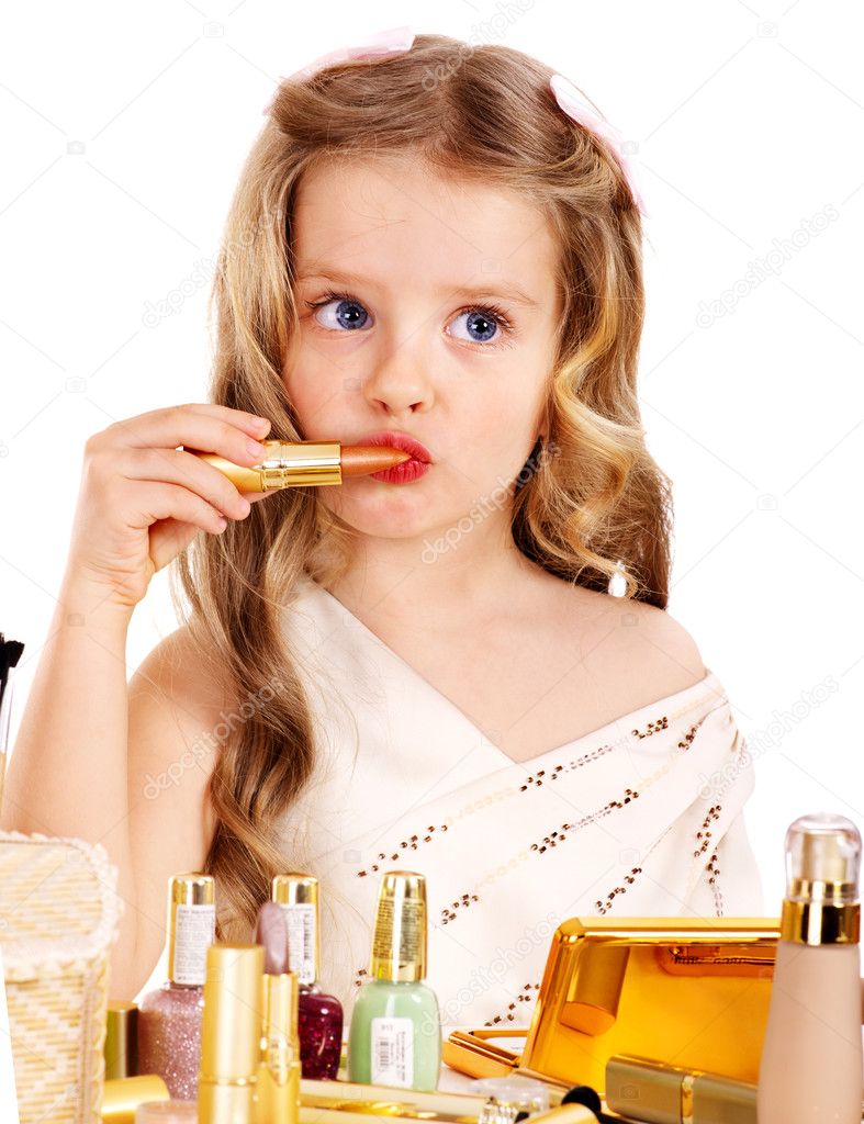 Child cosmetics. Little girl with lipstick.