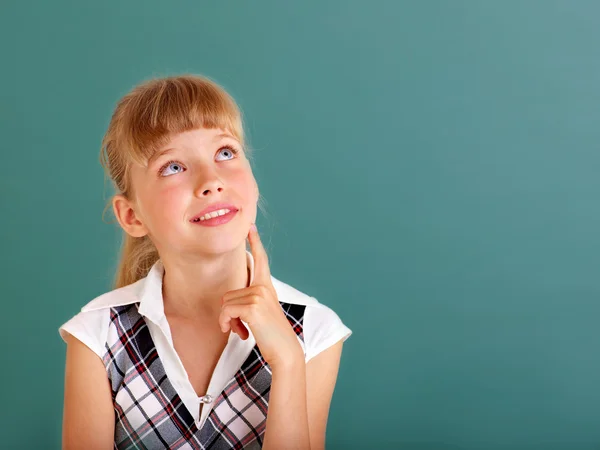 Schoolchild near green blackboard. — Stock Photo, Image