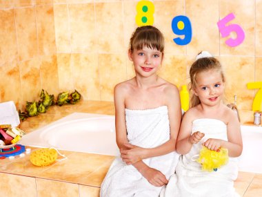 Children washing in bubble bath . clipart