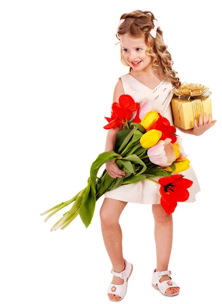 Child with spring flower and gift box. — Stock Photo, Image