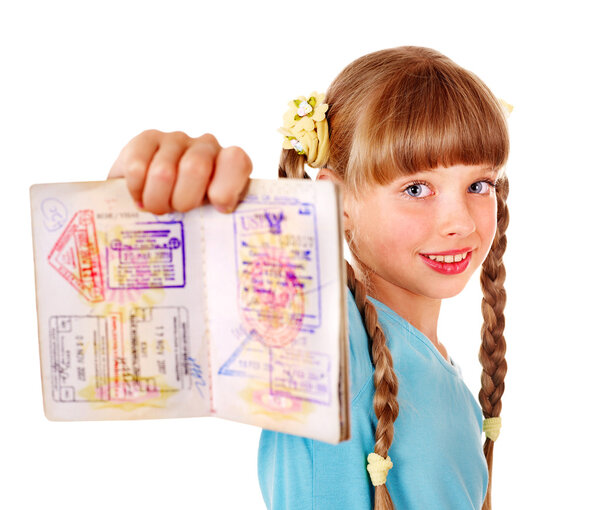 Child holding passport. Foreign vacation.