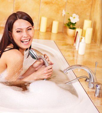 Woman take bubble bath. clipart