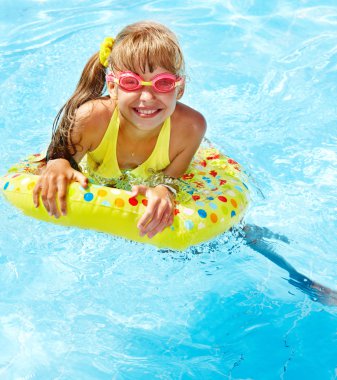 Child in swimming pool. clipart