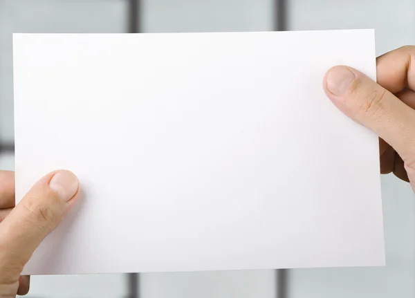 Paper in hands — Stock Photo, Image