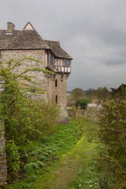 Stokesay Castle in Shropshire on cloudy day clipart