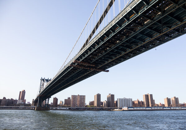 Midtown Manhattan visible under span of Manhattan bridge