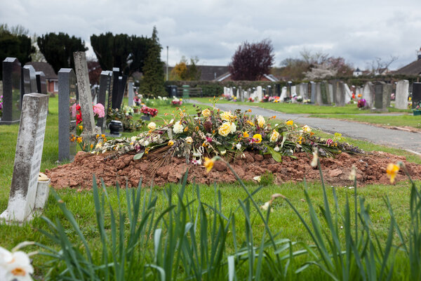 Freshly dug grave in cemetery