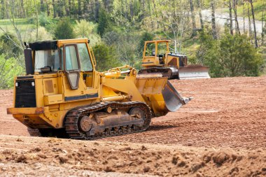 Large earth mover digger clearing land clipart