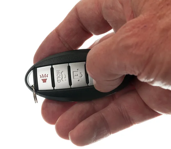 Thumb on keyless wireless door opener — Stock Photo, Image