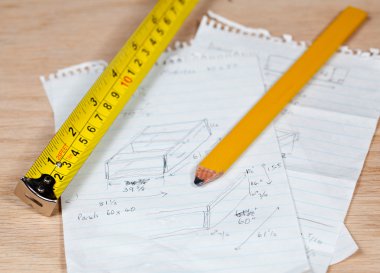 Carpenter pencil and rule on plans clipart