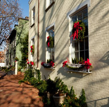 Cream colored house with xmas wreath clipart